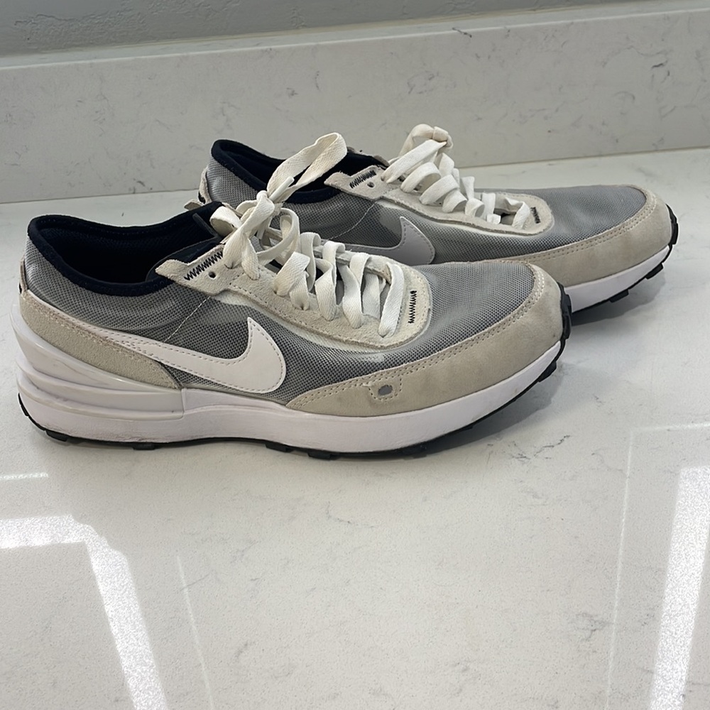 White Nike youth tennis shoes